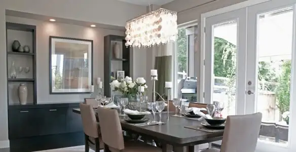 Elegant dining room chandelier installation above table in Oklahoma City, OK