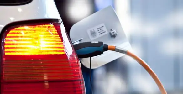 Electric car plugged into EV charger after professional installation in Oklahoma City, OK