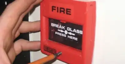 fire alarm installation service showing manual fire alarm pull station installed by licensed electricians in Oklahoma City, OK