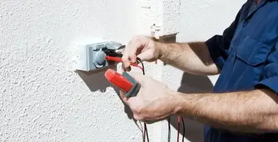 Electrician performing home electrical outlet and wiring inspection in Oklahoma City, OK