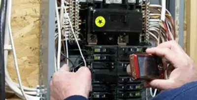 Home electrical inspection of circuit breaker panel by licensed electrician in Oklahoma City, OK
