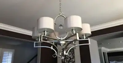 Modern chandelier installation with multiple light fixtures in Oklahoma City, OK