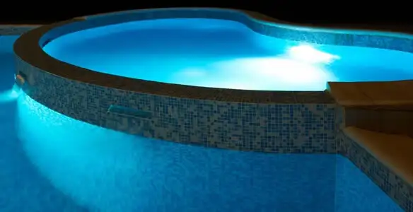 pool light installation and repair services highlighting illuminated pool interior lighting in Oklahoma City, OK