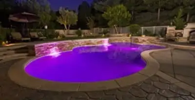 pool light installation and repair services illuminating a residential swimming pool in Oklahoma City, OK