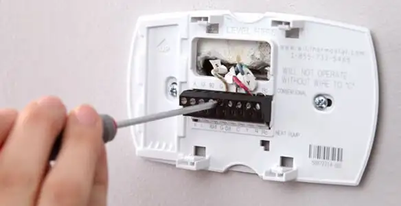 Thermostat installation service with proper wiring and secure wall mounting in Oklahoma City, OK